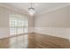 Formal dining room with hardwood floors, wainscoting, and chandelier at 630 Darlington Commons Ne Ct, Atlanta, GA 30305