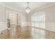 Spacious dining room with hardwood floors, chandelier, and large window at 630 Darlington Commons Ne Ct, Atlanta, GA 30305