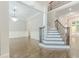 Grand entryway with hardwood floors, staircase, and elegant chandelier at 630 Darlington Commons Ne Ct, Atlanta, GA 30305