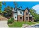 Side view of a charming two-story house with brick and white accents at 630 Darlington Commons Ne Ct, Atlanta, GA 30305