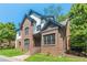 Two-story home with brick and siding, showcasing a welcoming front entrance at 630 Darlington Commons Ne Ct, Atlanta, GA 30305