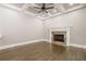 Gathering room features hardwood floors, fireplace, and coffered ceiling at 630 Darlington Commons Ne Ct, Atlanta, GA 30305