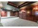 Spacious home theater with dark wood paneling, projector, and plush carpeting at 630 Darlington Commons Ne Ct, Atlanta, GA 30305