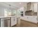 Modern kitchen with white cabinets, stainless steel appliances, and large island at 630 Darlington Commons Ne Ct, Atlanta, GA 30305