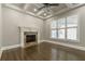 Living room featuring hardwood floors, fireplace and coffered ceiling at 630 Darlington Commons Ne Ct, Atlanta, GA 30305