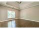 Spacious main bedroom with hardwood floors and tray ceiling at 630 Darlington Commons Ne Ct, Atlanta, GA 30305