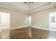 Main bedroom with hardwood floors, tray ceiling and ensuite bathroom at 630 Darlington Commons Ne Ct, Atlanta, GA 30305