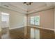Spacious main bedroom with hardwood floors and tray ceiling at 630 Darlington Commons Ne Ct, Atlanta, GA 30305