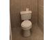 Small bathroom featuring a standard toilet with tiled walls at 665 Roxford Ln, Buford, GA 30518