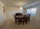Formal dining room featuring a chandelier, a buffet, and an elegant dining table at 665 Roxford Ln, Buford, GA 30518