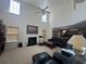 Spacious living room with fireplace, large windows, ceiling fan, and comfortable seating at 665 Roxford Ln, Buford, GA 30518