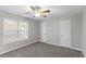 Bright bedroom with ceiling fan, carpet, and ample closet space at 1029 Chaterly Ct, Riverdale, GA 30296