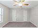 Spacious bedroom with ceiling fan and double closets at 1029 Chaterly Ct, Riverdale, GA 30296