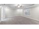 Spacious bedroom with ceiling fan and grey carpet at 1029 Chaterly Ct, Riverdale, GA 30296