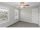 Bedroom with ceiling fan, large window, and closet at 1029 Chaterly Ct, Riverdale, GA 30296