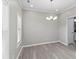 Bright dining room with hardwood floors and chandelier at 1029 Chaterly Ct, Riverdale, GA 30296