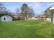 Large backyard with a shed and spacious green lawn at 1207 Eastview Ne Rd, Conyers, GA 30012