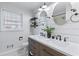 Updated bathroom with double vanity, shiplap walls, and hexagon tile floor at 1207 Eastview Ne Rd, Conyers, GA 30012