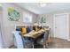 Bright dining area with built-in bench seating and a farmhouse table at 1207 Eastview Ne Rd, Conyers, GA 30012