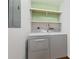 Practical laundry room with washer, dryer, and extra shelving at 1207 Eastview Ne Rd, Conyers, GA 30012