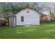 Gray storage building with double doors and small window at 1207 Eastview Ne Rd, Conyers, GA 30012