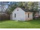 Ample storage shed in the backyard with a Captain America shield at 1207 Eastview Ne Rd, Conyers, GA 30012