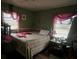 Bedroom with double bed and green walls at 2621 Patrick Se Ct, Atlanta, GA 30317