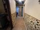 Hallway with floral wallpaper and tile floor at 2621 Patrick Se Ct, Atlanta, GA 30317