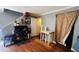 Another view of the living room featuring hardwood floors, a table, and a door at 345 Lexington Dr, Lawrenceville, GA 30046