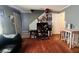 View of the living room with hardwood floors, table, and entrance to a hallway at 345 Lexington Dr, Lawrenceville, GA 30046