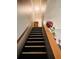 Carpeted stairway leads to the upper level, illuminated by overhead lighting at 345 Lexington Dr, Lawrenceville, GA 30046