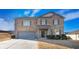 Two-story brick home with gray garage door and landscaping at 8484 Glenview St, Douglasville, GA 30134