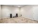 Finished basement with neutral colored carpet and recessed speakers at 2760 Veltre Sw Ter, Atlanta, GA 30311