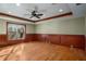 Finished basement room with hardwood floors and wainscoting at 2760 Veltre Sw Ter, Atlanta, GA 30311