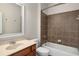 Clean bathroom with brown tile shower/tub combo and wood vanity at 2760 Veltre Sw Ter, Atlanta, GA 30311