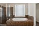 Luxurious bathroom with a large soaking tub and shower at 2760 Veltre Sw Ter, Atlanta, GA 30311