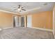 Spacious primary bedroom with carpet, ceiling fan, and ample closet space at 2760 Veltre Sw Ter, Atlanta, GA 30311