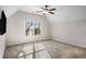 Spacious bedroom with neutral walls and carpet flooring, featuring a ceiling fan and large window at 2760 Veltre Sw Ter, Atlanta, GA 30311