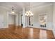 Formal dining room with hardwood floors, chandelier, and wainscoting at 2760 Veltre Sw Ter, Atlanta, GA 30311