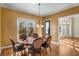 Bright dining room features hardwood floors and a charming table with seating for six at 2760 Veltre Sw Ter, Atlanta, GA 30311