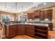 Open kitchen with island and breakfast bar, granite countertops at 2760 Veltre Sw Ter, Atlanta, GA 30311