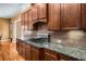 Modern kitchen with granite countertops and gas cooktop at 2760 Veltre Sw Ter, Atlanta, GA 30311