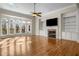 Spacious living room with hardwood floors, fireplace, and large windows at 2760 Veltre Sw Ter, Atlanta, GA 30311