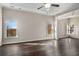 Sunlit main bedroom with hardwood floors and high ceilings at 2760 Veltre Sw Ter, Atlanta, GA 30311