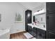 Spa-like bathroom with a double vanity, soaking tub, and dark cabinets at 3569 Lynne Rd, Powder Springs, GA 30127