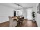 Elegant dining room features hardwood floors, an oval table and stylish light fixture at 3569 Lynne Rd, Powder Springs, GA 30127