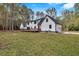 Modern house exterior with a large backyard, deck, and garage at 3569 Lynne Rd, Powder Springs, GA 30127