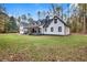 Charming house exterior showcasing a large backyard and modern updates at 3569 Lynne Rd, Powder Springs, GA 30127