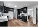 Modern kitchen with dark cabinetry, quartz countertops, and stainless steel appliances at 3569 Lynne Rd, Powder Springs, GA 30127