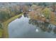 Aerial view of homes and lake with fountain at 3799 Halisport Nw Ln, Kennesaw, GA 30152